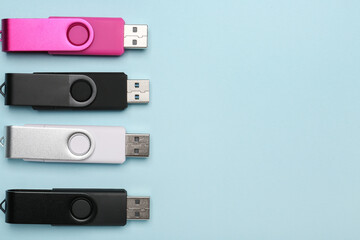 USB flash drives on blue background