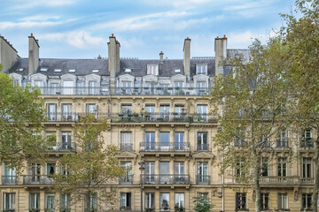 Fototapeta na wymiar Paris, typical facade in autumn, building boulevard Richard-Lenoir, in the 11e arrondissement 