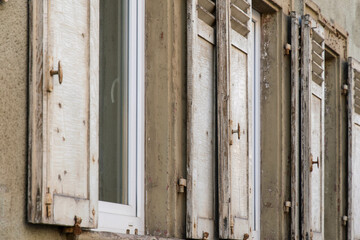 old wooden shutters on a house facade