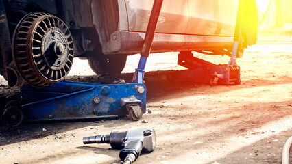 the car at the tire repair station changes the winter rubber to summer