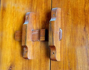 handmade wooden lock or ancient door latch. 
Thailand traditional wood door  