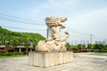 The stone carving of a dragon in the park ， taken in Xihu Park, Changsha City, Hunan Province,...