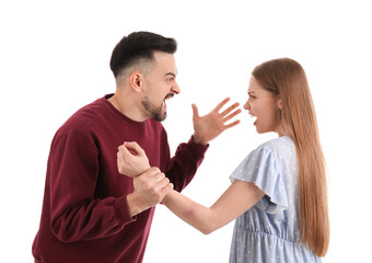 Angry young couple shouting on white background. Domestic violence concept