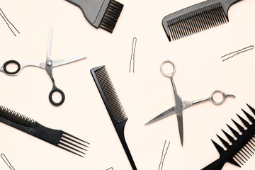 Hairpins with brushes and scissors on beige background
