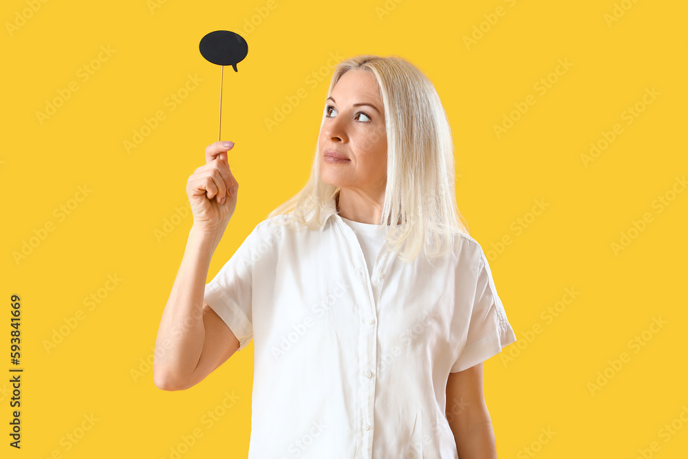 Canvas Prints Mature woman with speech bubble on yellow background