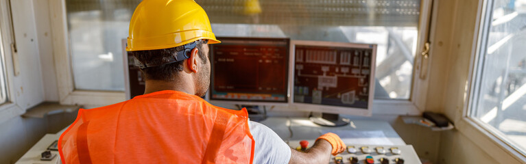 Experienced operator concentrating at his work in plant