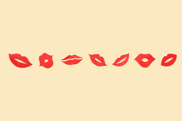 Red paper lips on beige background