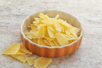 Sliced parmesan cheese heap in the bowl