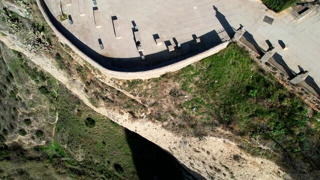 Aerial pullback tilt up reveals stunning homes of ronda cliffs spain