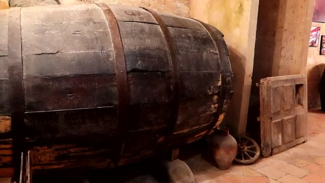 Old historic wooden wine barrel in cellar, Aranda de Duero, Burgos. Pan right