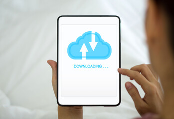 Back view of woman using cloud drive technology download or upload save files from internet. Data...