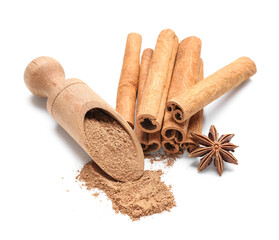 Scoop of powder with cinnamon sticks and anise on white background