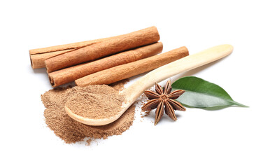 Spoon of powder with cinnamon sticks, anise and leaf on white background