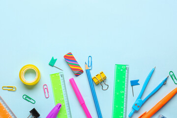 Stationery supplies on blue background