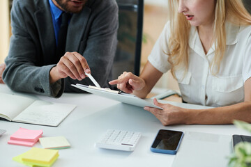 Cropped image of business people proofreading contract before meeting with investor