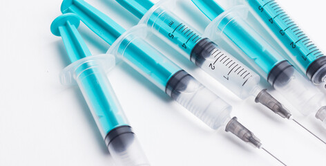 Disposable plastic syringe prepared for injection and vaccination in the hospital. The concept of...
