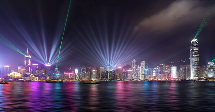 Hong Kong October 16 2019:  Victoria Harbor and Hong Kong skyline with the light show at night