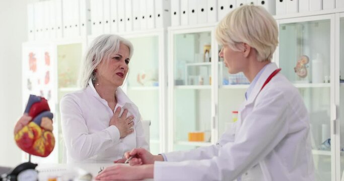 Elderly woman sees cardiologist because of heart disease and hypertension. Ischemic heart disease in elderly