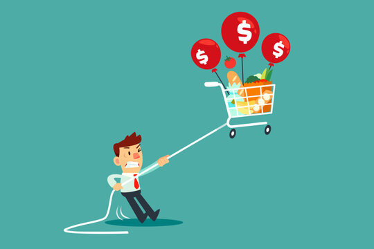 businessman holding rope tie to floating shopping cart with balloon