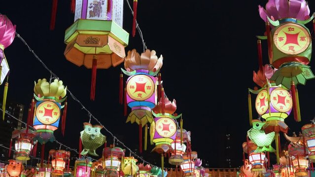 Chinese colorful lanterns, which symbolize prosperity and good fortune, hang from ceiling wires during the Mid-Autumn Festival, also called Mooncake Festival.