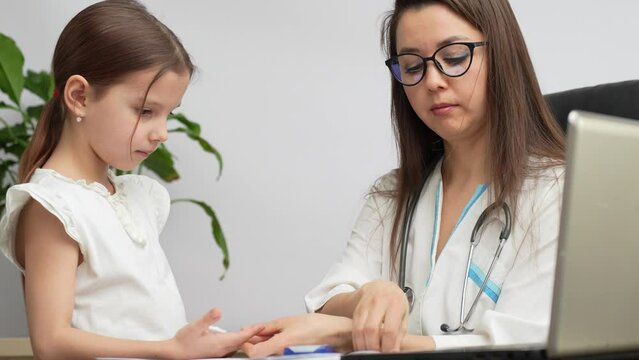Doctor check child diabetes test, close-up