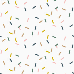 Colorful abstract confetti sprinkles seamless pattern background.