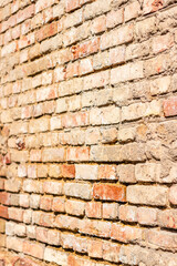 Wall of yellow and red old bricks. Texture background.