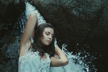 Woman and waterfall's power