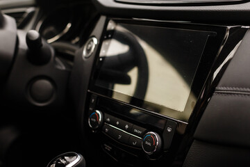 Fototapeta na wymiar Modern car interior with dashboard and multimedia
