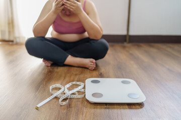 Obese Woman with fat upset bored of dieting Weight loss fail  Fat diet and scale sad asian woman...
