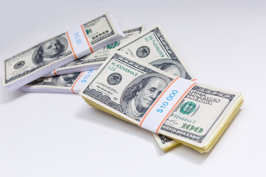 Set of a packs of dollars with a rubber band isolated on a white background