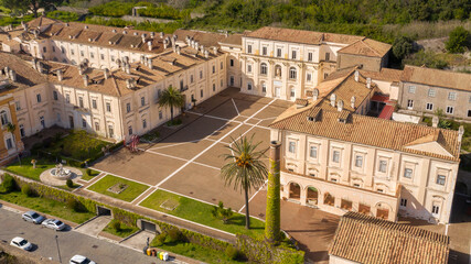 Aerial view of the Belvedere di San Leucio, a monumental complex located in Caserta, in Campania, Italy. It is Unesco world heritage site and an ancient Bourbons Royal residence and silk factory. - obrazy, fototapety, plakaty