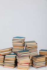 science education stack of books on white background teaching literacy