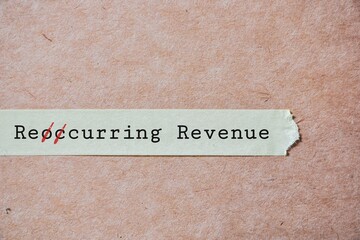 Recurring revenue inscription on masking tape. Conceptual image of converting reoccurring revenue to recurring one in the business for benefits. 