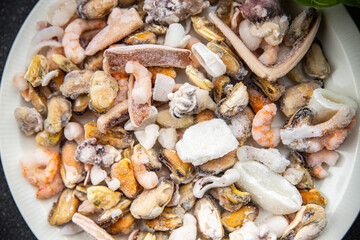 seafood frozen food Seafood Cocktail mussels, rapan, octopus, scallop, squid healthy meal food snack on the table copy space food background rustic top view pescatarian diet