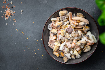 seafood frozen food Seafood Cocktail mussels, rapan, octopus, scallop, squid healthy meal food snack on the table copy space food background rustic top view pescatarian diet