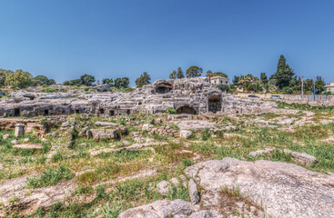 The overgrown Grotticelli Necropolis (graveyard) of the Ancient Greeks of Syracuse, Sicily. The ruins where Archimedes is supposed to be buried.