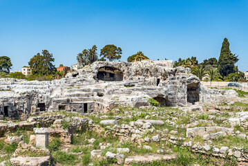 The overgrown Grotticelli Necropolis (graveyard) of the Ancient Greeks of Syracuse, Sicily. The ruins where Archimedes is supposed to be buried.