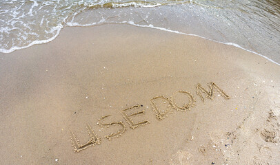 Sandy beach on the island of Usedom, with the lettering 'Usedom'