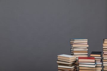 science education stack of books on grey background learning literacy