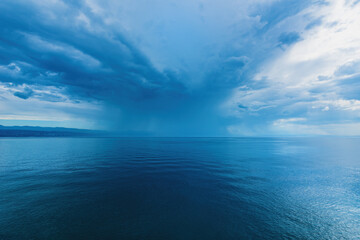 Naklejka na ściany i meble Stormy rain cloud over the sea, summer tempest at the Adriatic sea coastline