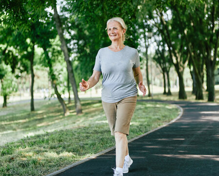 outdoor senior fitness woman lifestyle active sport exercise healthy fit elderly mature running jogging run runner jogger walking walk fast