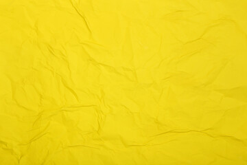 Yellow crumpled paper sheet