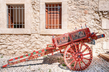 Typical colorful sicilian cart with its characteristic and folkloristic decorations - obrazy, fototapety, plakaty