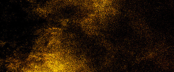 Gold glitter powder splash on black background, gold Glitter Texture Isolated on Black Background, Golden stardust, splash of golden sparkles on black background.