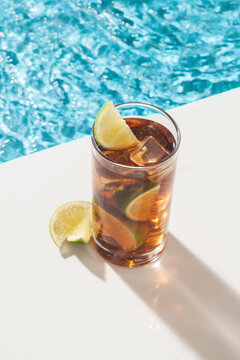 cocktail and lemon in the pool