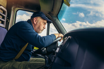 Professional driver driving a truck on the road.