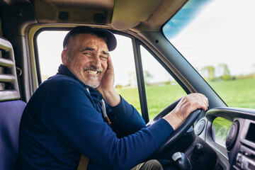 Professional driver driving a truck on the road.