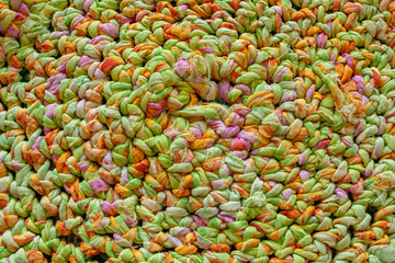 the texture of a green woven rug, knitted in a circle