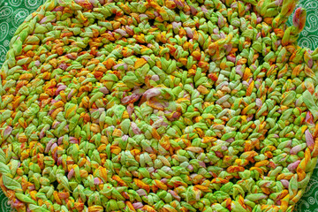 the texture of a green woven rug, knitted in a circle